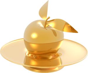 A golden apple with two gold leaves on a pedestal plate