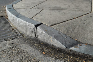Sidewalk granite curb cut for wheelchair ramp, Philadelphia PA