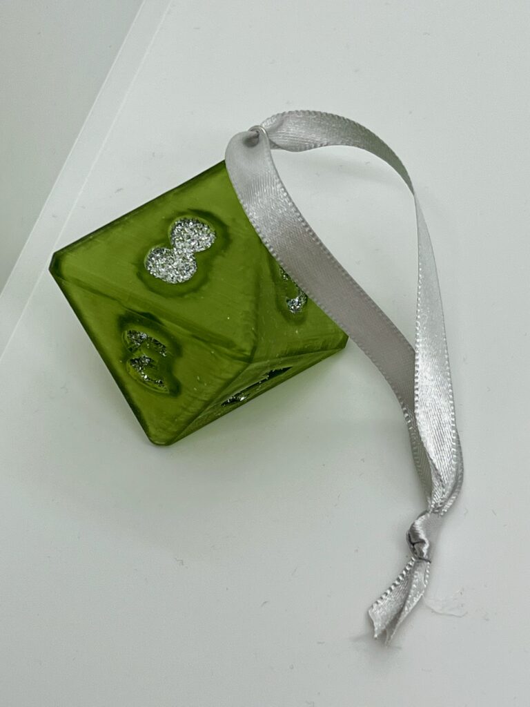 green D8 with silver glitter numbers and silver ribbon