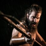 shirtless viking warrior with ax